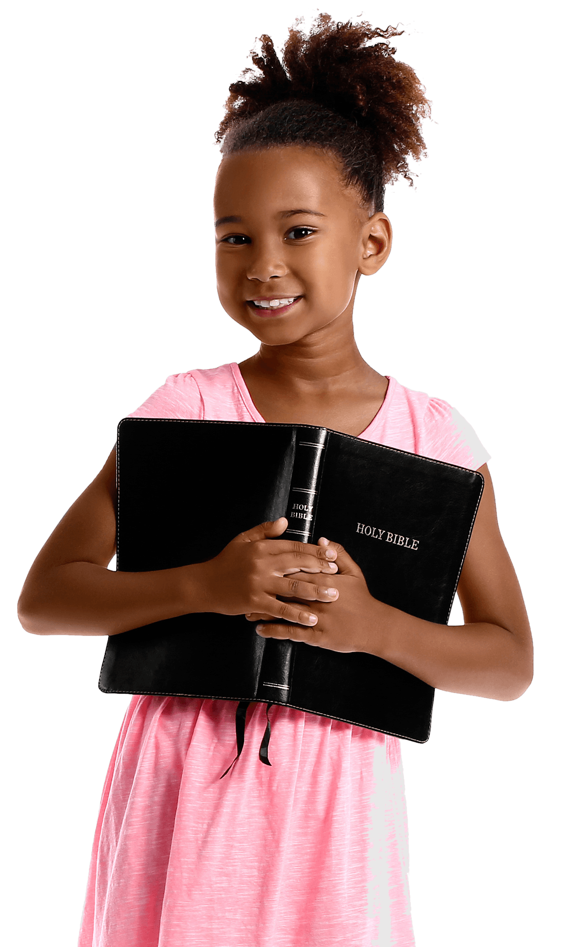 A smiling girl holding her Bible